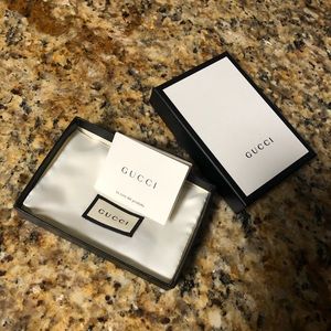 Gucci box and dust bag.